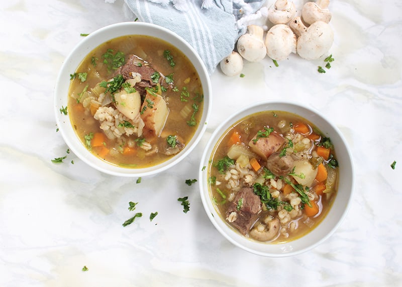 Beef and Barley soup in two separate bowls