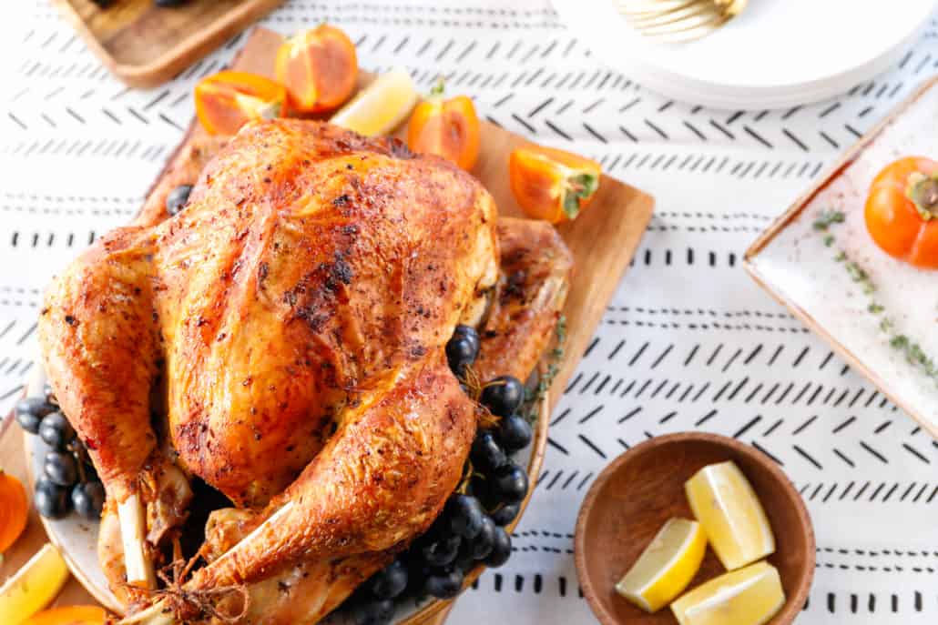 https://crescentfoods.com/wp-content/uploads/2021/10/roasted-whole-turkey-on-a-table-with-persimmon-blu-M2LBK2K-1030x687.jpg
